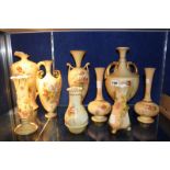 A selection of Royal Worcester ivory-ground porcelain, including ewers and vases decorated with