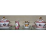 A pair of French porcelain sauce tureens and covers in the Sèvres style; a Paris porcelain cup and