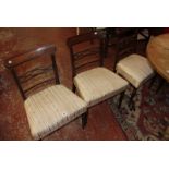 A set of six Regency mahogany dining chairs each with lattice work bar splat, upholstered seat on