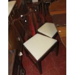 A set of George III style mahogany dining chairs each with a carved toprail and pierced splat and