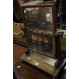 An early 19th Century mahogany swing dressing table mirror.