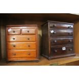 A miniature mahogany chest of four long graduating drawers and circular brass handles, 32cm high
