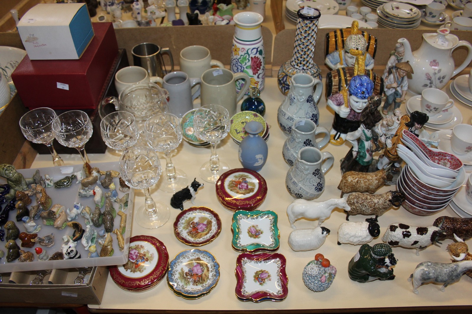 An assortment of decorative ceramics and glass to include Wade whimsies, Royal Doulton 'Pillar Rose'