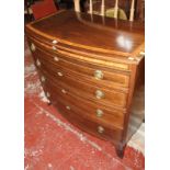 An early 19th Century mahogany and crossbanded bowfront chest with four long drawers on splayed feet