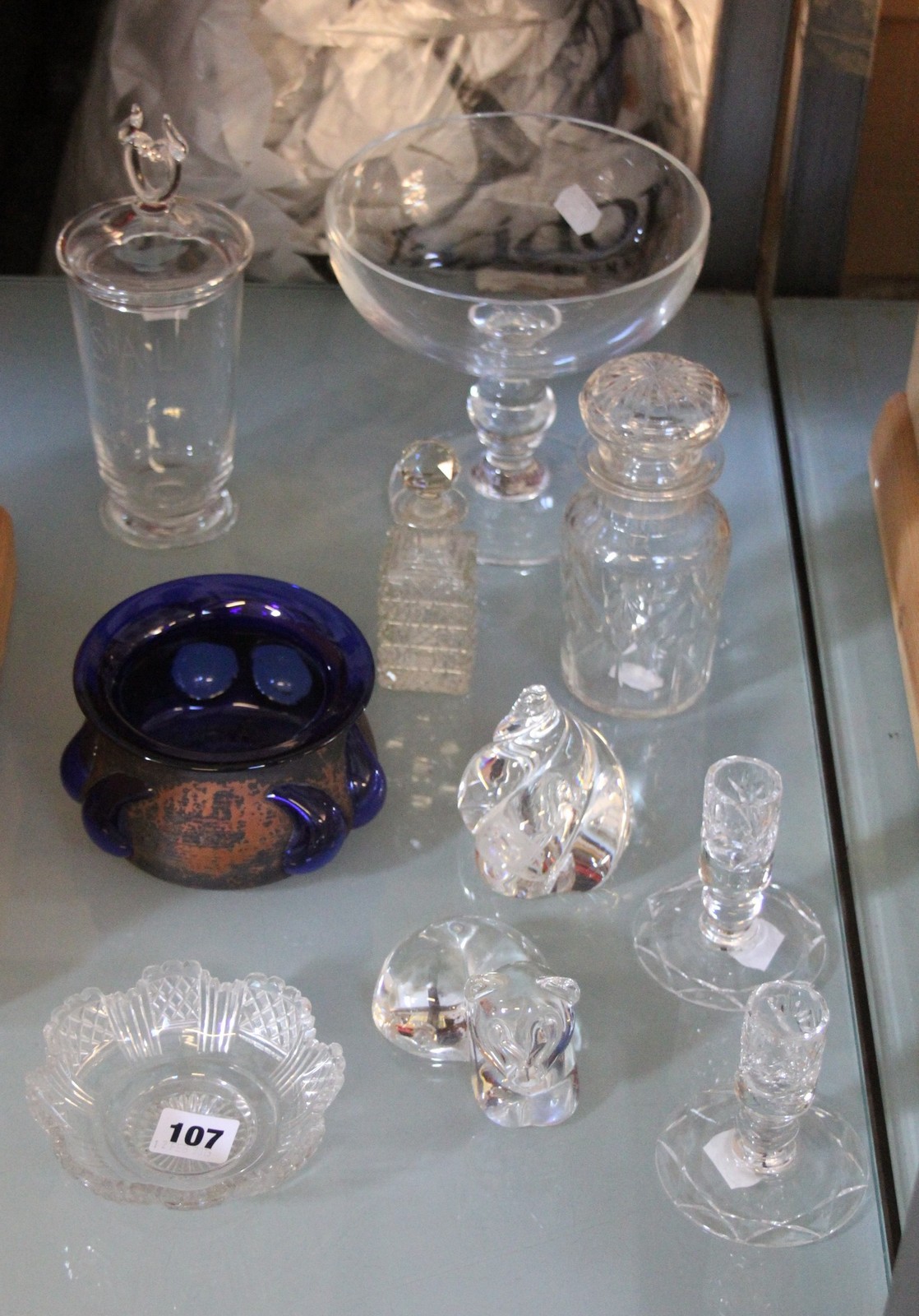 A Steuben glass model of a cat, another model of a shell, a Steuben vase and cover and other