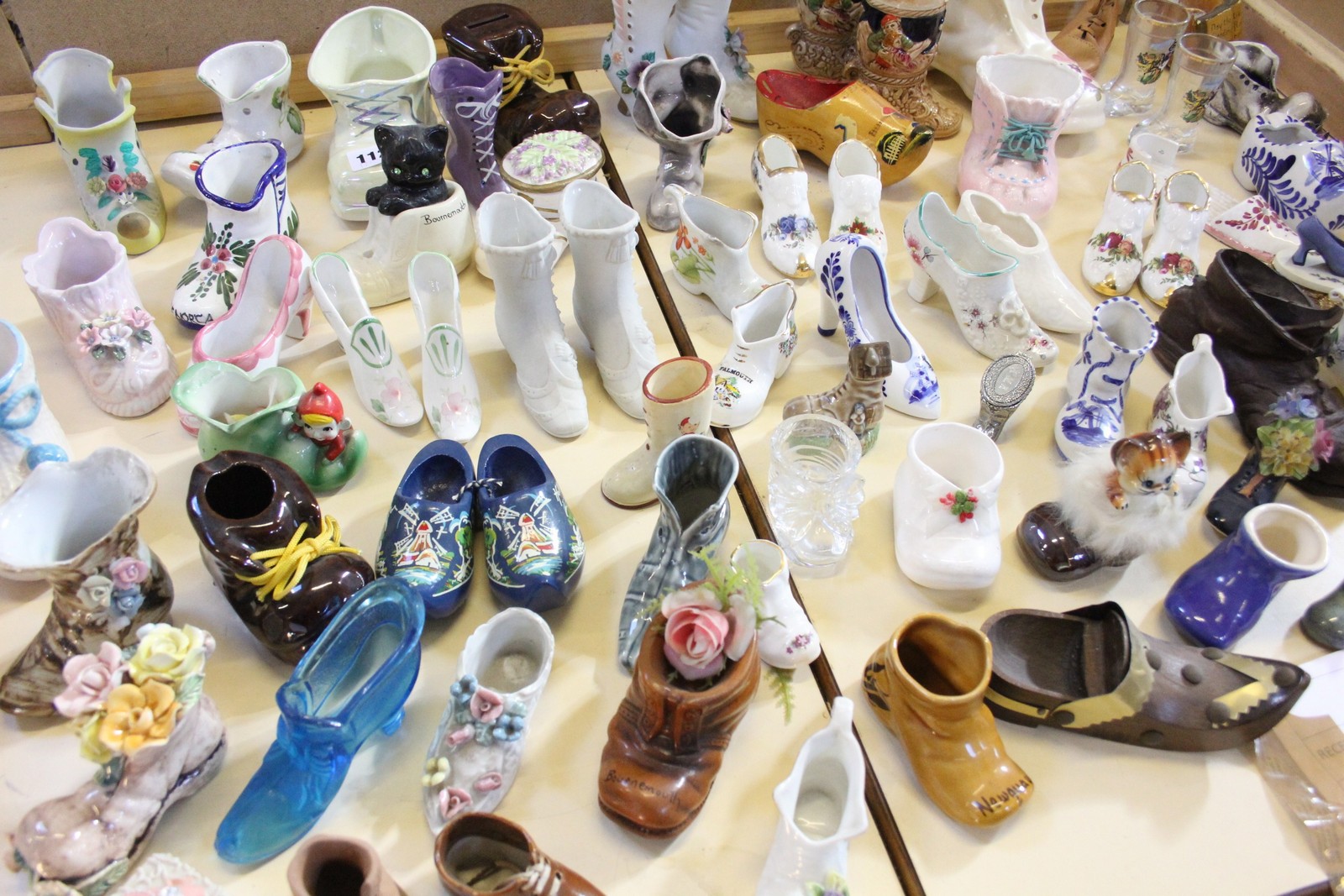 A quantity of assorted porcelain collectors slippers and boots, (qty)