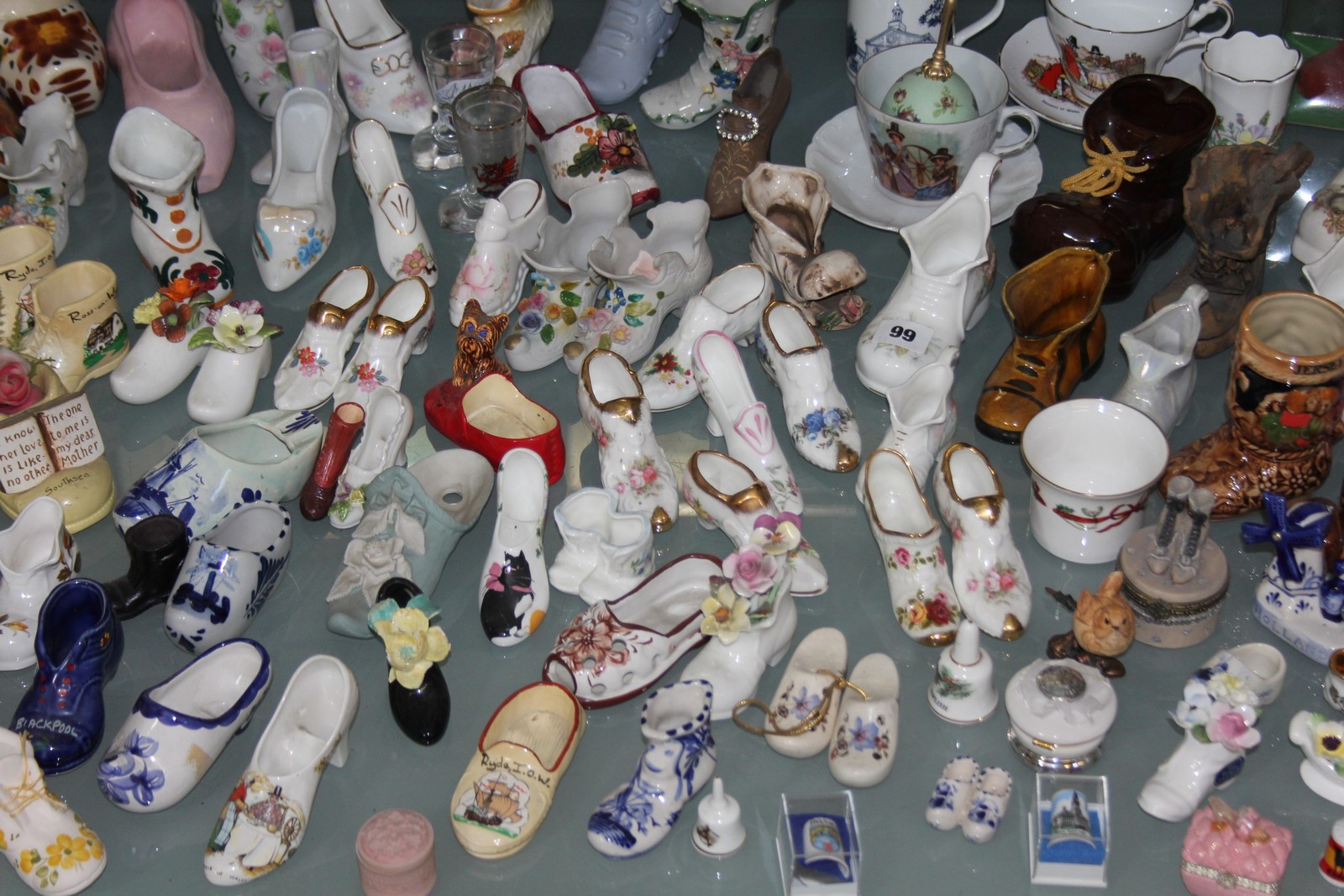 A quantity of assorted porcelain collectors slippers and boots, (qty)