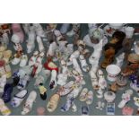 A quantity of assorted porcelain collectors slippers and boots, (qty)