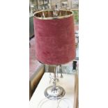 A silver plated whale oil lamp converted to a table lamp, with maroon shade, 77cm approx. Please