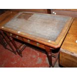 An Aesthetic period mahogany writing table with inset writing surface with two frieze drawers on