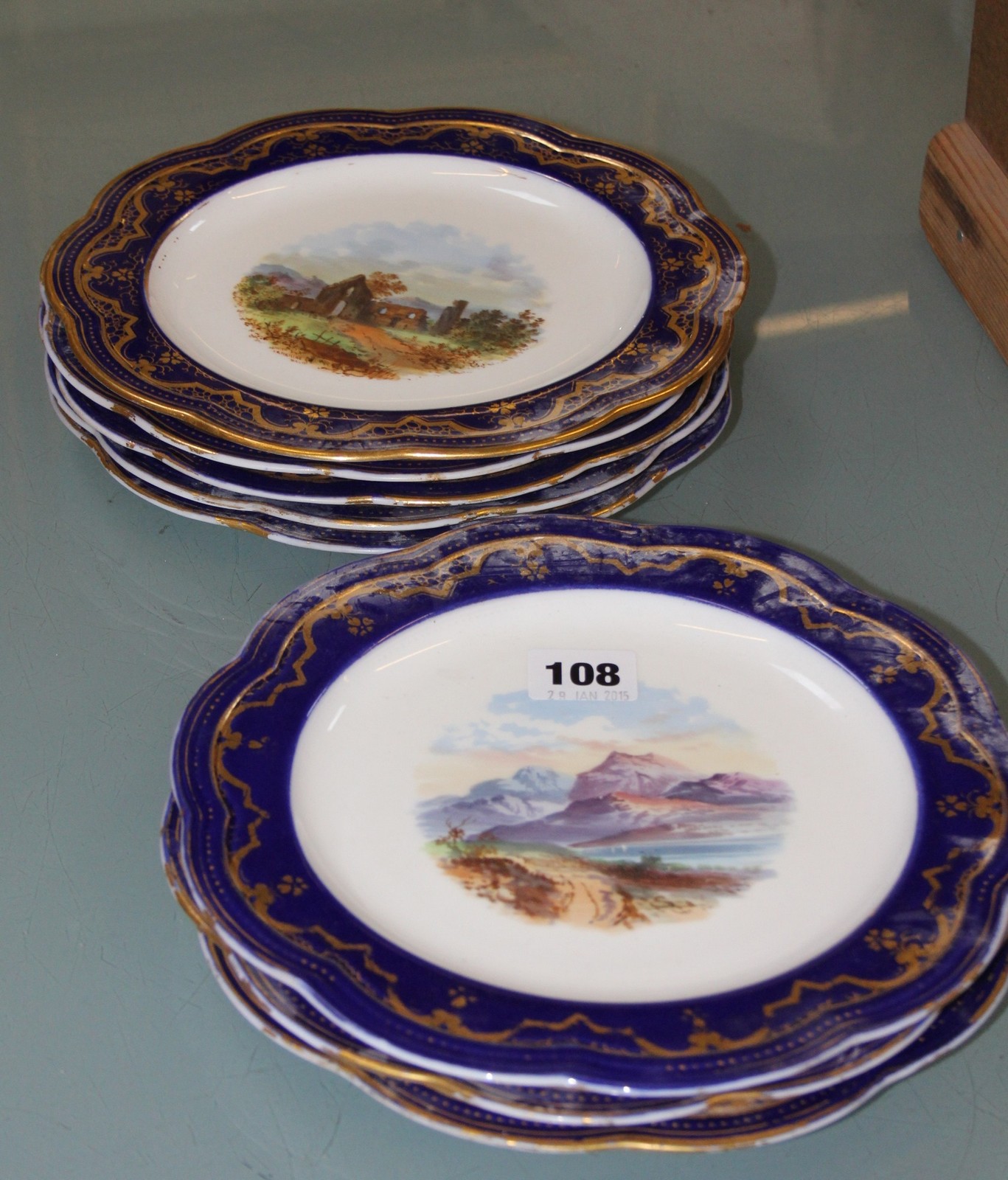 Wedgwood cabinet plates, blue and gilt borders, painted with landscapes, titled to reverse -8