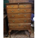 An 18th Century oak chest on stand, with two short and four long drawers with a shaped apron on