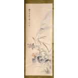A Chinese painted scroll of flowers and birds by Shao Jun Xian