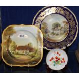 A Royal Crown Derby plate painted with a cottage by W E J Dean, a small Royal Worcester desert