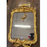 An 18th Century style gilt mirror, the cresting centred by a bird craning its head 87cm high, 52cm