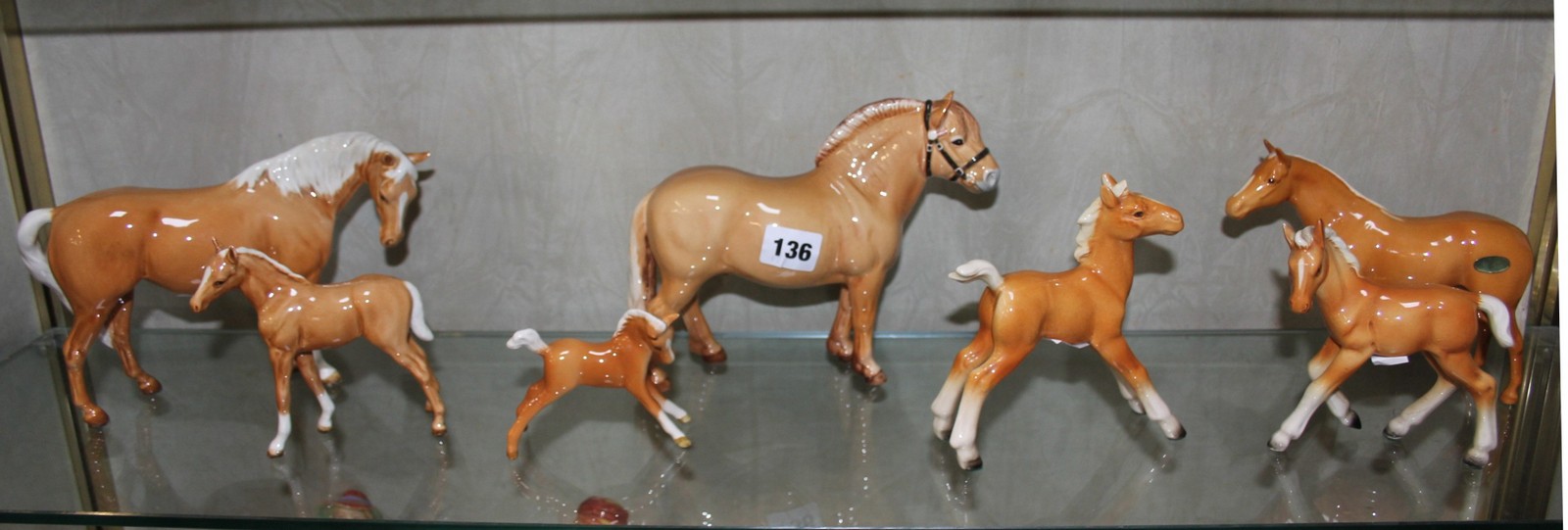 A Beswick Norwegian Fjord horse, 16cm high, a Beswick Palomino horse, 15cm high, another smaller,