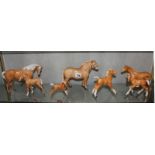 A Beswick Norwegian Fjord horse, 16cm high, a Beswick Palomino horse, 15cm high, another smaller,