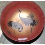 Set of eight late 19th/ early 20th Century Japanese red lacquered bowls, gilt decorated with herons,