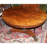 A Victorian rosewood breakfast table with a turned column on triform base and claw feet 72cm high,