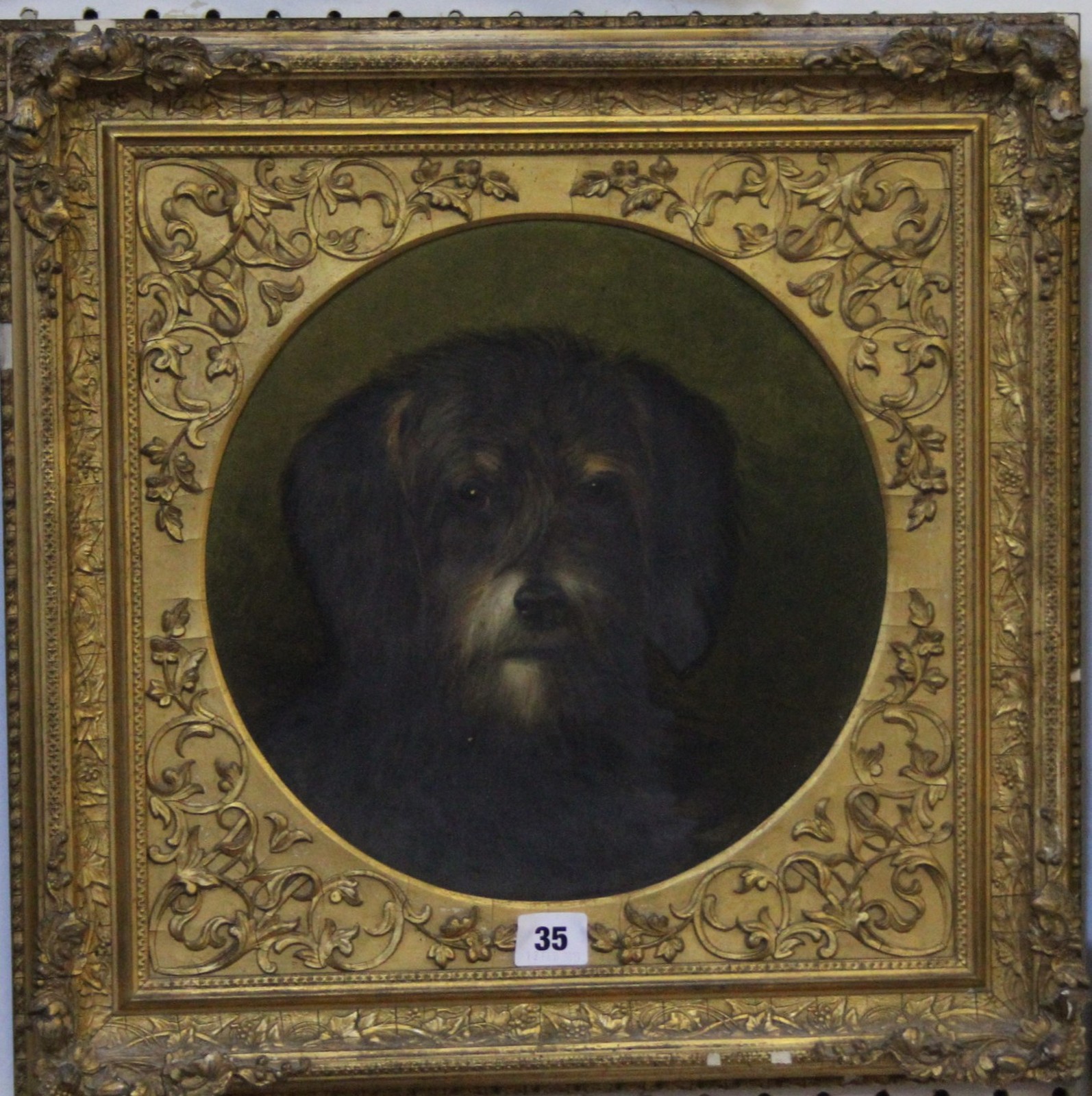 English School (19th Century) A circular portrait of a dog Oil on board Unsigned 28.5cm diameter