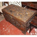 A 20th century Oriental carved camphor wood chest.