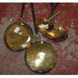 An 18th century Dutch brass warming pan with cast iron handle, another, three cream scoops and a