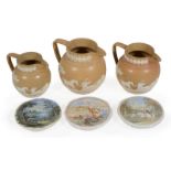 A garniture of three Copeland drab-coloured stoneware hunting jugs, last quarter 19th century,