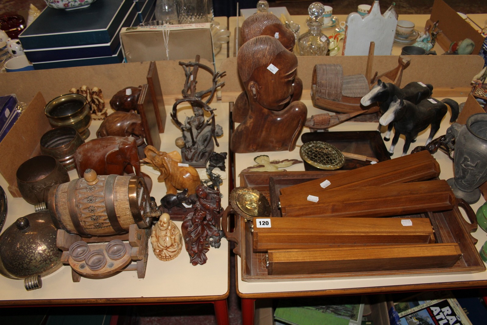 A quantity of carved wooden items and treen to include elephant bookends, carved wooden trays,