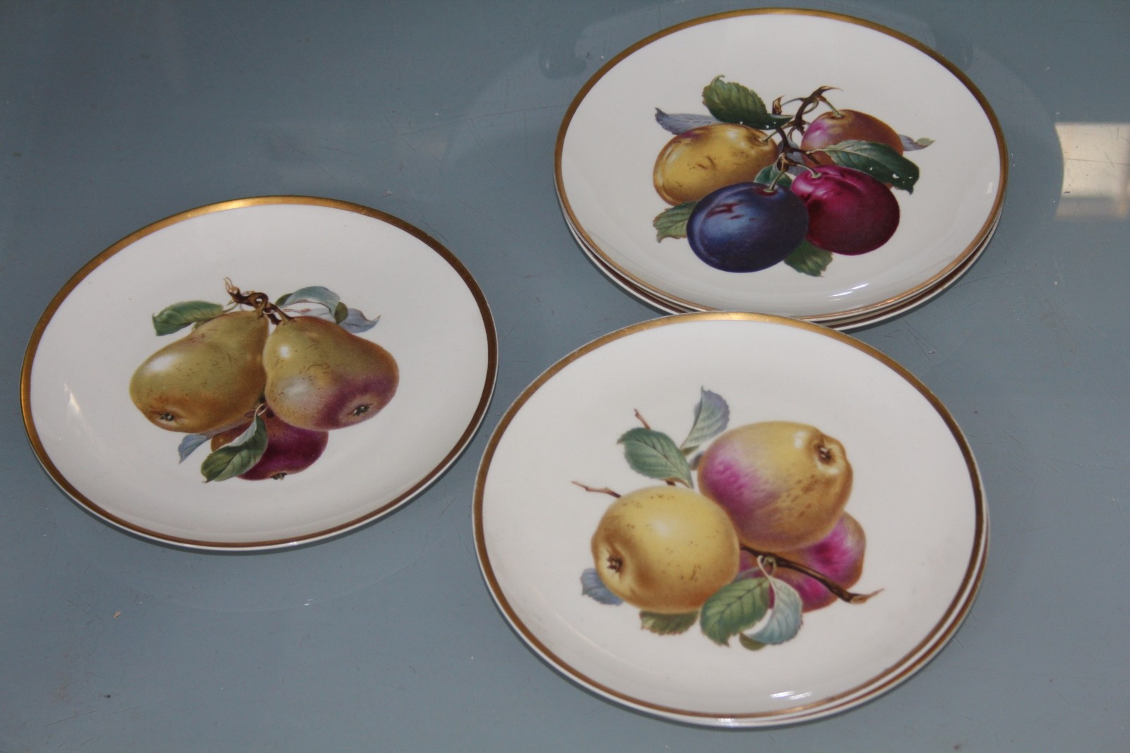 A large Rosenthal circular plate decorated with fruit, 34cm in diameter and five smaller Rosenthal