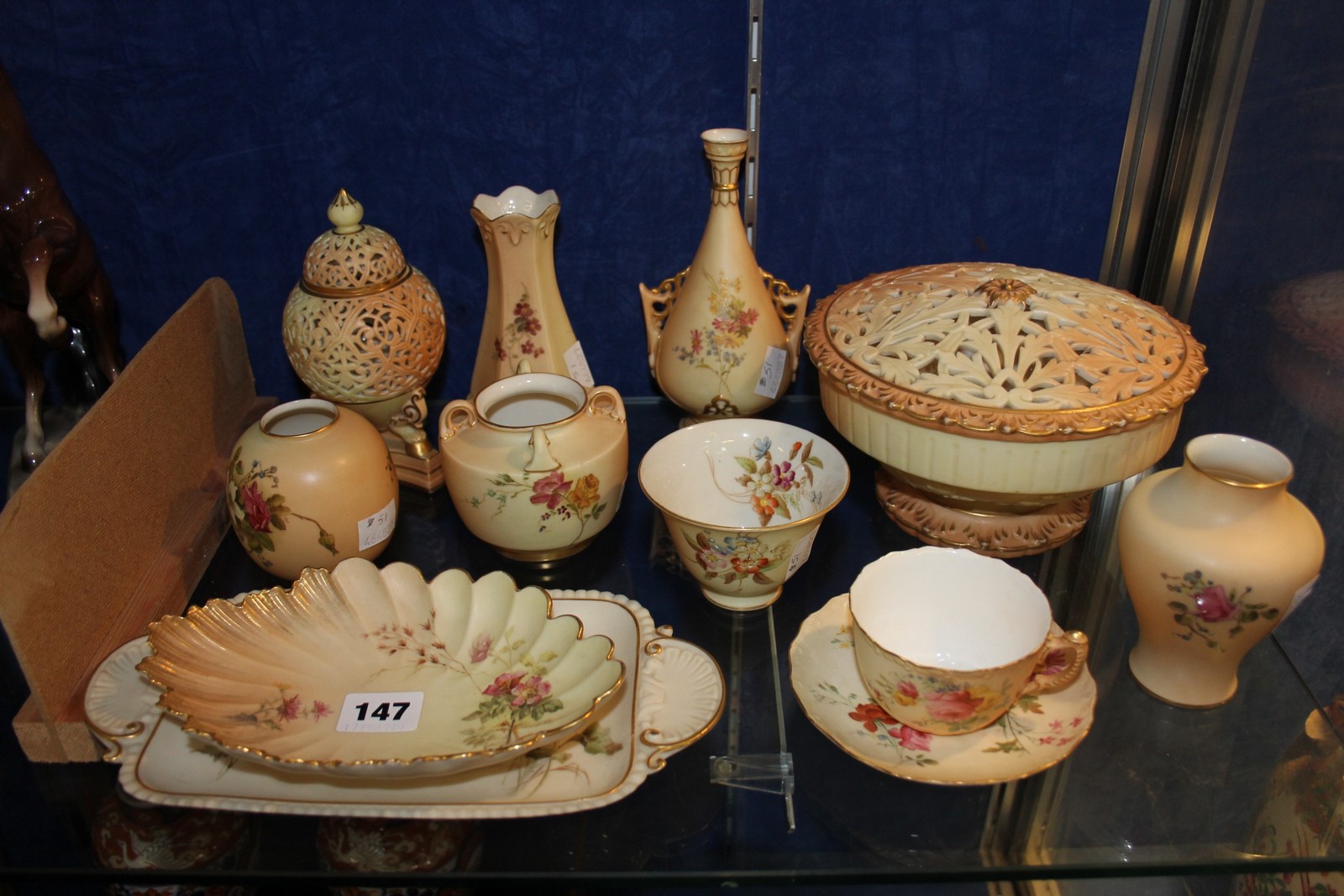 A selection of Royal Worcester ivory-ground porcelain, including trays, a potpourri pierced cover, a