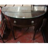 A George III style mahogany bowfront side board with a frieze drawer flanked by two cupboards on