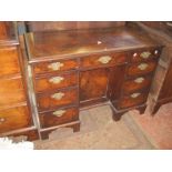 An 18th Century style walnut kneehole desk 108cm wide