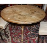 A circular pine pedestal dining table 76cm high, 120cm diameter