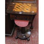 A Victorian rosewood work and games table