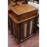 A Victorian walnut restaurant reception stand with a fold over desk over mirrored pull back doors
