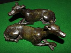 A pair bronze recumbent greyhounds, 18cm long approx.