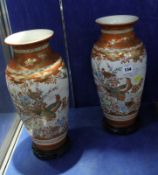 Pair Japanese Imari vases, baluster shaped, on circular wooden bases, 40cm high