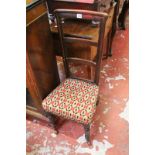 A Regency rosewood high-back chair, circa 1815, of narrow proportions, the tapering ladder back