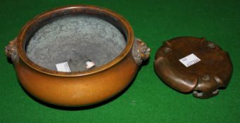 Chinese bronze censer, 16cm in diameter approx. and a bronze stand (2). Best Bid