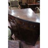 A late Regency mahogany standing corner cupboard, circa 1820 and later, the top above central frieze