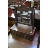 A Regency dressing mirror of small proportions together with another on bobbin turned supports