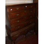 An 18th Century and later oak chest on stand, with two short and three long graduated drawers on