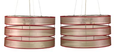 A pair of modern plated metal, fabric and glass cylindrical hanging ceiling...  A pair of modern