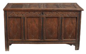 A Charles II oak coffer , circa 1680, the four panel top opening to large...  A Charles II oak