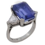 A platinum tanzanite and diamond three stone ring  A platinum tanzanite and diamond three stone