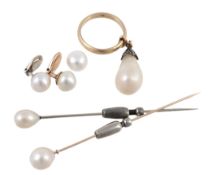 A natural baroque pearl drop, the natural baroque pearl with a rose cut diamond set surmount, on a