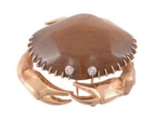 A tiger's eye and diamond crab brooch by Mauboussin, the crab with a tiger  A tiger's eye and