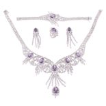 A diamond and amethyst suite, the necklace with articulated swags of...  A diamond and amethyst