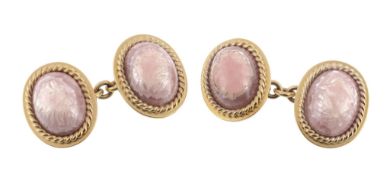 A pair of rhodocrosite cufflinks, the oval cabochon rhodocrosite within a...  A pair of rhodocrosite