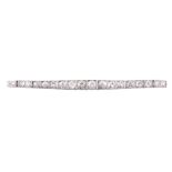 An early 20th century diamond graduated line bracelet  An early 20th century diamond graduated